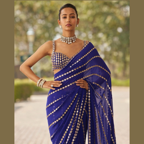 Blue Georgette Saree embellished with mirror work and a designer blouse