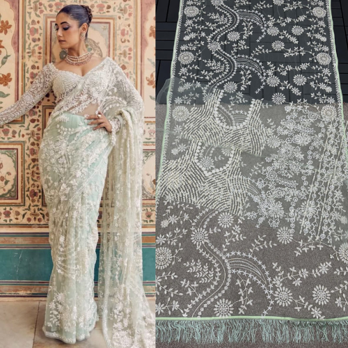 White Net saree embellished with Sequin Work and tassels in pallu with Designer Blouse