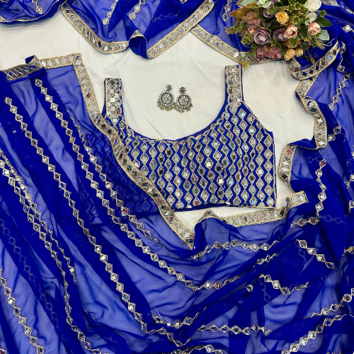 Blue Georgette Saree embellished with mirror work and a designer blouse