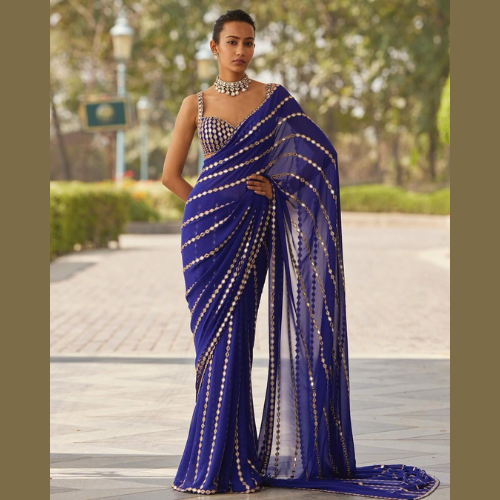 Blue Georgette Saree embellished with mirror work and a designer blouse